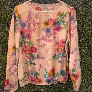 Satin floral blouse long sleeves with lace detail on the neck . Size 4
